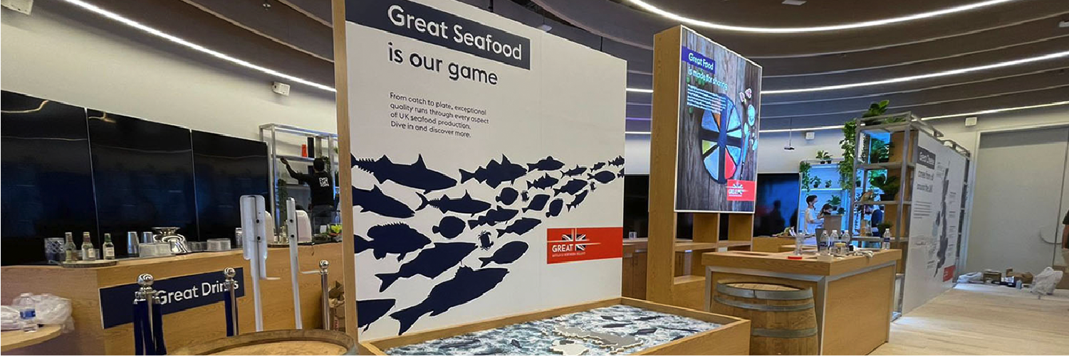 A pavilion interior balancing contemporary design, British cultural references, artistic displays and functional event spaces within one visitor journey.