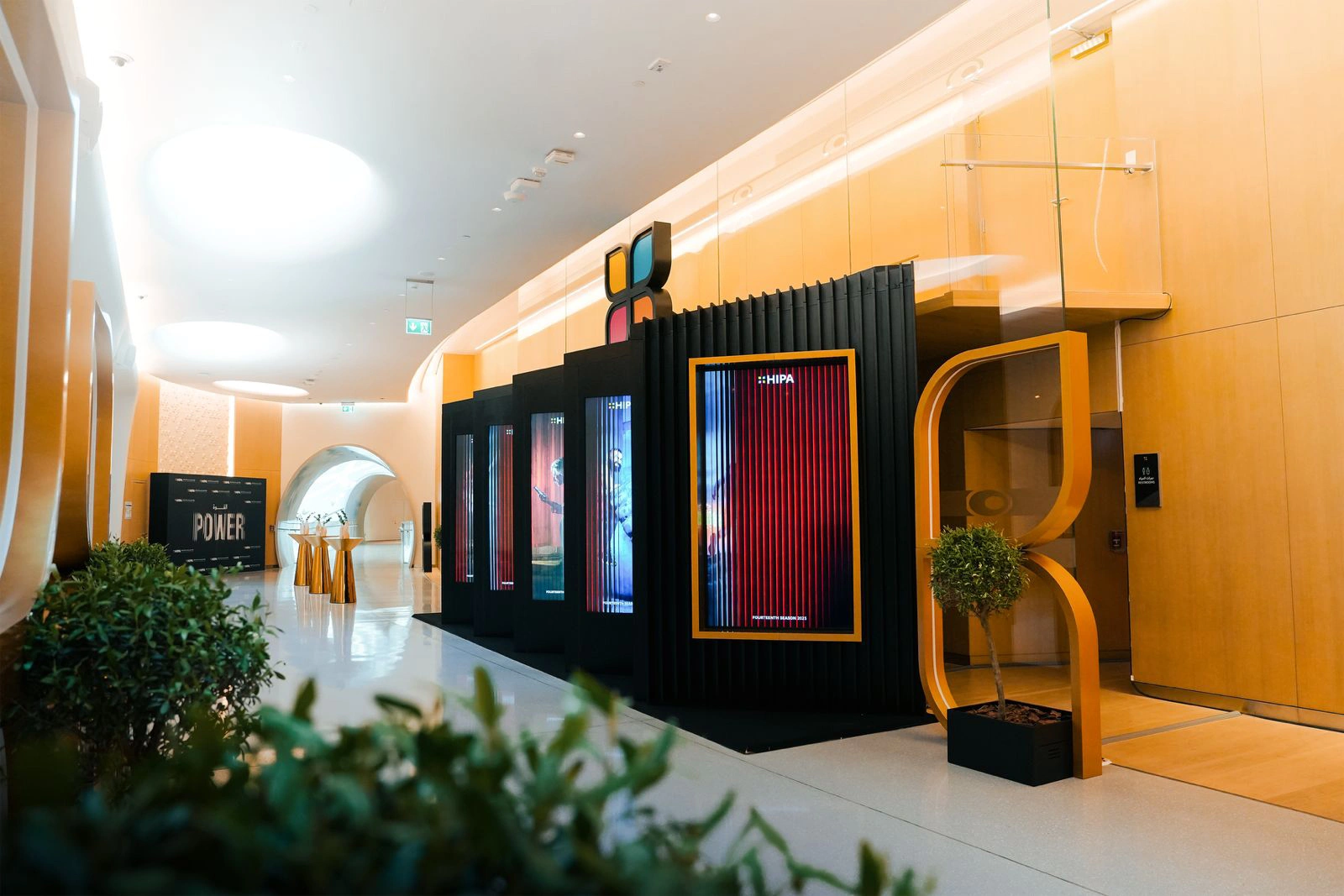Widescreen high-definition LED video wall presenting grand prize-winning photography entries