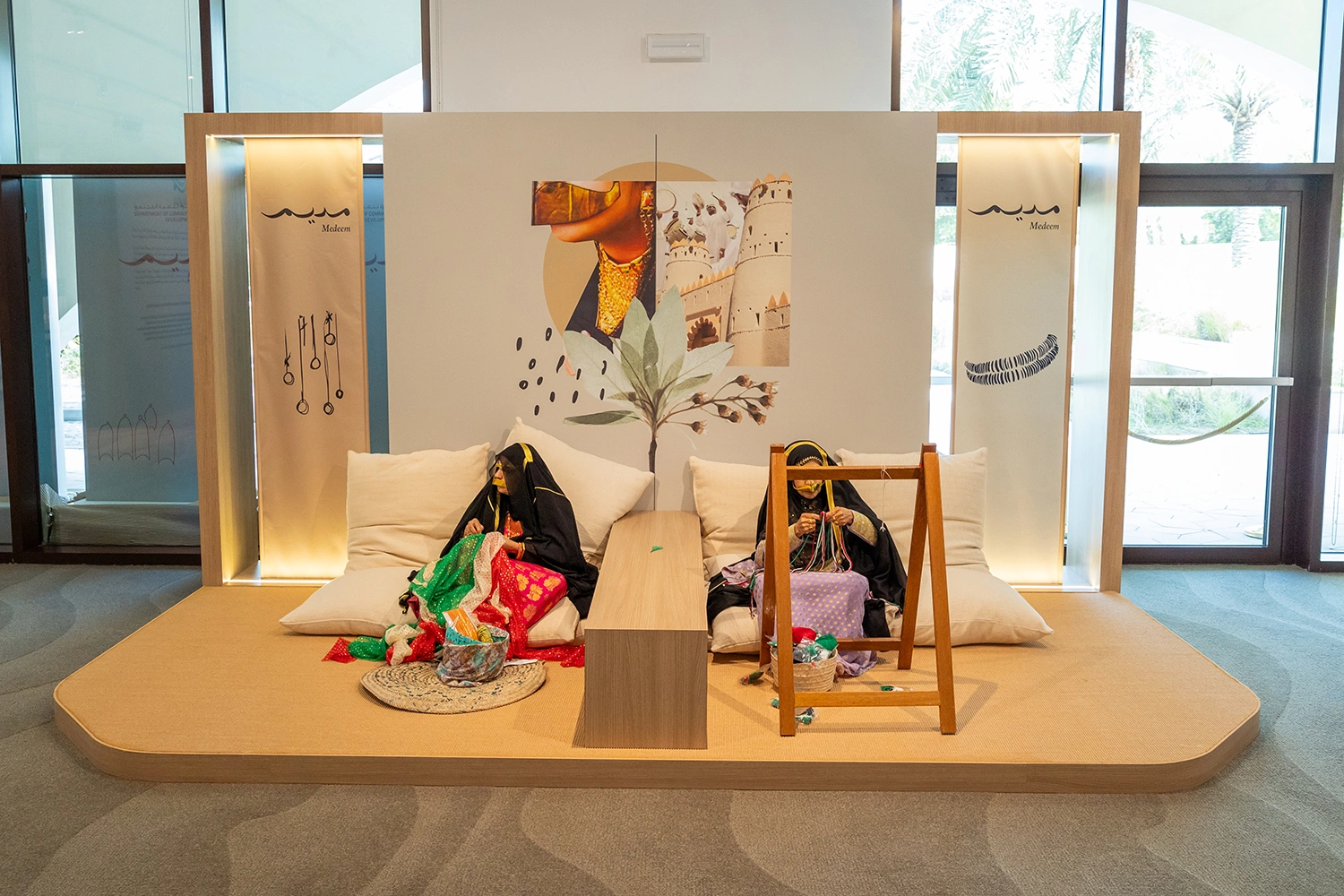 Modern family development initiative launch stage with warm wood finishes in Abu Dhabi