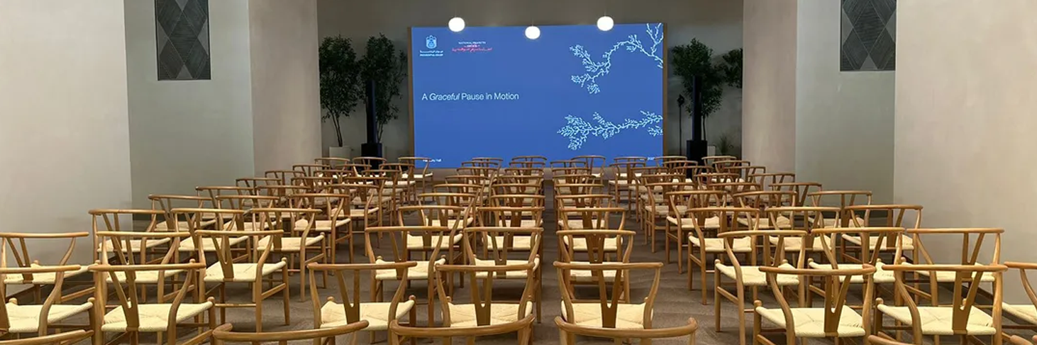An anniversary environment at Erth Hotel combining Atolye’s design language with framed project stories, custom branding, floral detail and integrated AV.