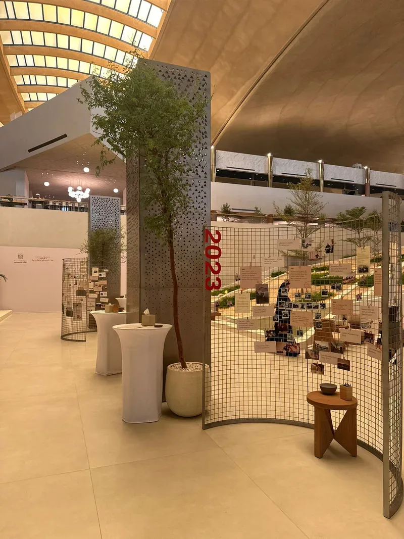 NPO fourth anniversary exhibition featuring a 2023 milestone timeline, photo displays and natural greenery