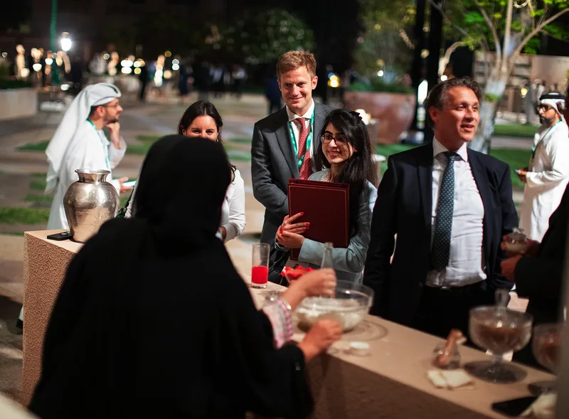 International delegates networking during the curated Pre-COP28 evening reception in Abu Dhabi