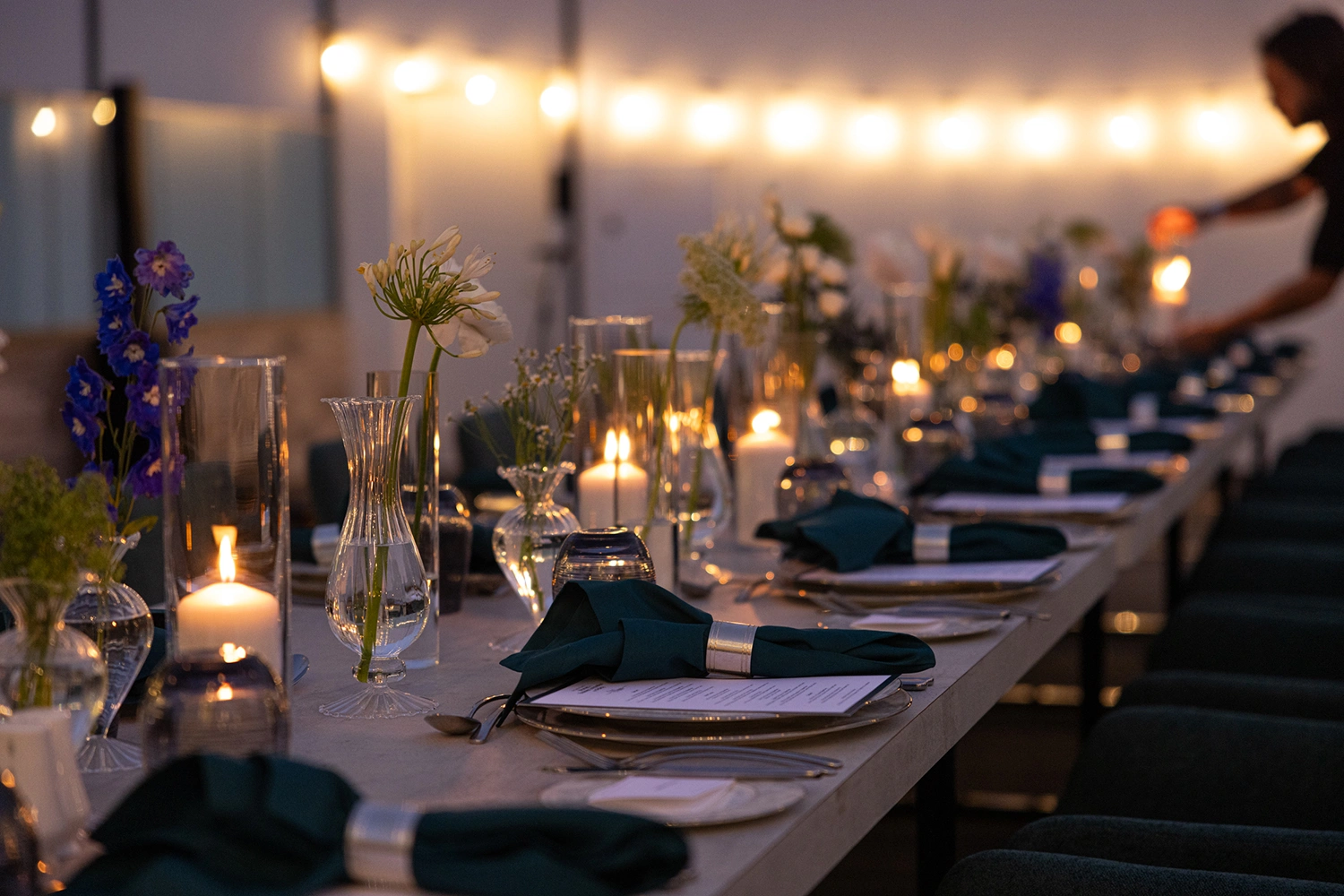 Evolution Technical ambient lighting casting warm golden hues across gala dining tables