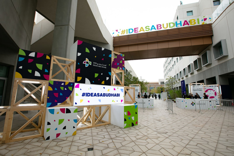 Photo of branding within an entry way into the Idea Abu Dhabi festival