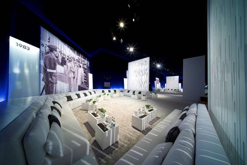 Interior shot of majlis, with VIP furniture, and large scale printed backdrops